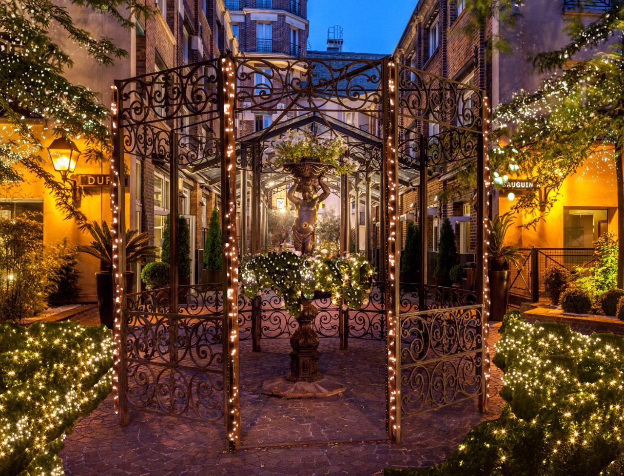 Hotel Les Jardins Du Marais Parigi Esterno foto